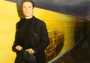 Laurent Chabot devant sa réalisation de palissade de chantier à Montigny-le-Bretonneux - 1989